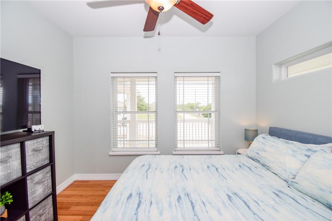 2006 1st Street Bayside, TX 78340 - Photo 27 of 37 a bedroom with a bed and a flat screen tv
