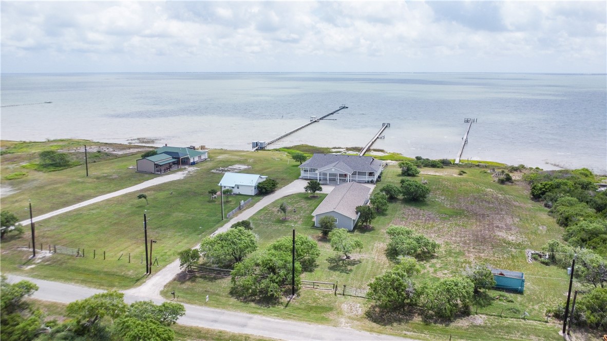 2006 1st Street Bayside, TX 78340 - Photo 33 of 37 an aerial view of a house with lots of trees
