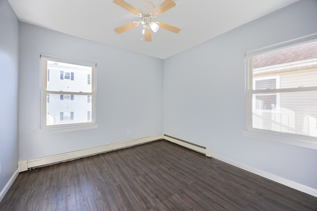 35 Hazel Street, Unit B Attleboro, MA 02703 - Photo 21 of 33 a view of empty room with wooden floor and fan