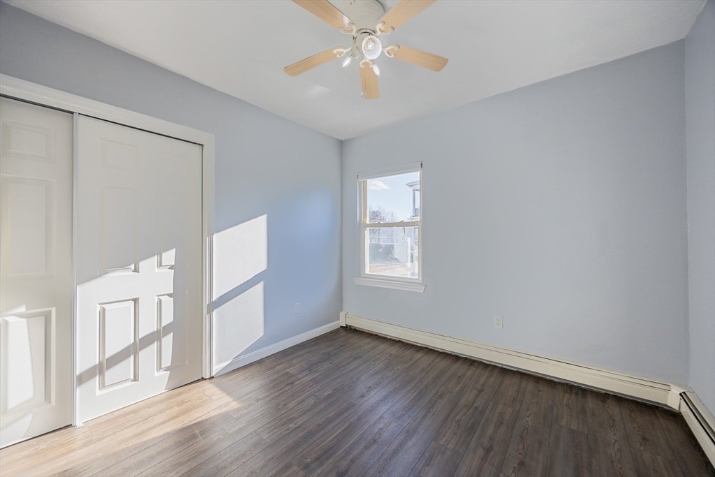 35 Hazel Street, Unit B Attleboro, MA 02703 - Photo 22 of 33 a view of empty room with wooden floor and fan