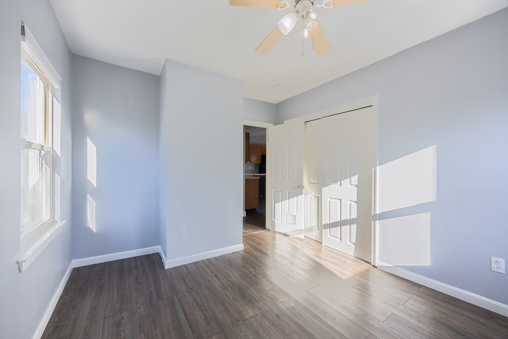 35 Hazel Street, Unit B Attleboro, MA 02703 - Photo 23 of 33 a view of empty room with wooden floor and fan