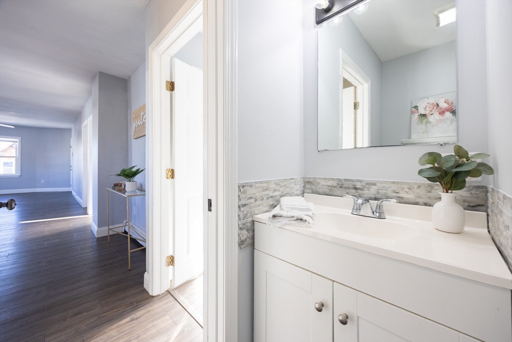 35 Hazel Street, Unit B Attleboro, MA 02703 - Photo 25 of 33 a bathroom with a sink and a mirror