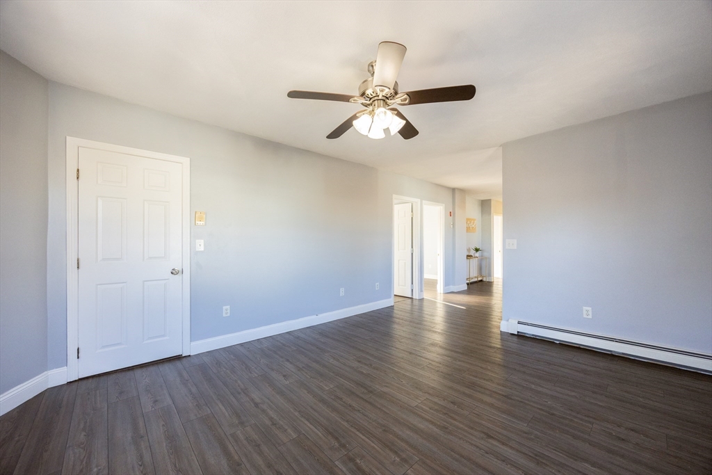 35 Hazel Street, Unit B Attleboro, MA 02703 - Photo 10 of 33 wooden floor in an empty room with a window
