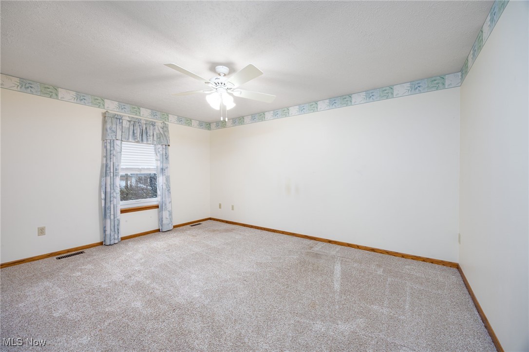 1838 Sandy Lake Road Ravenna, OH 44266 - Photo 31 of 41 Spacious upper-level bedroom with large closet and ceiling fan.