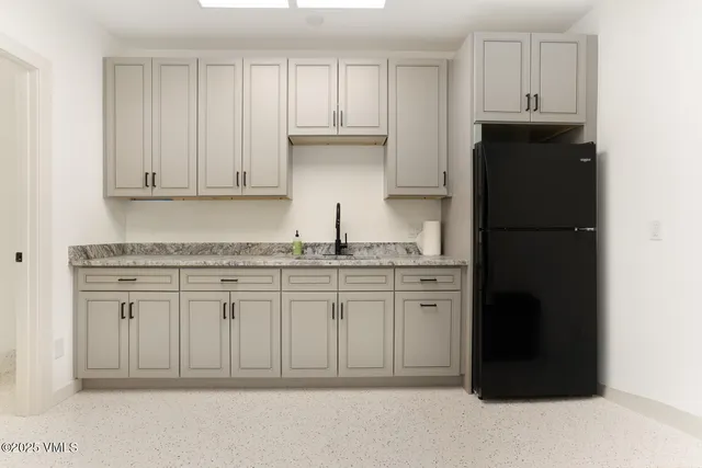 a bathroom with a sink toilet and a mirror