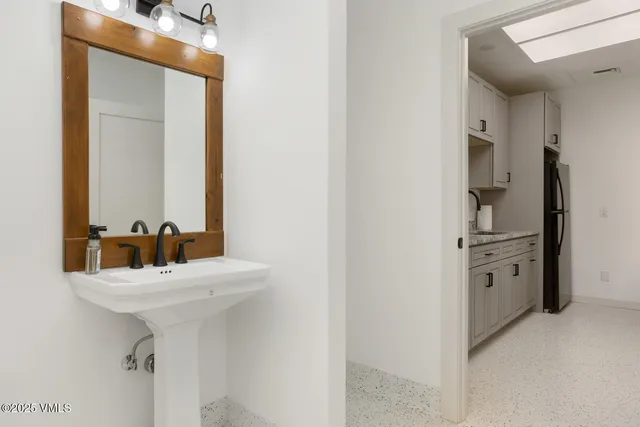 a view of a livingroom with furniture and chandelier