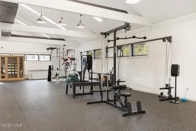 a bathroom with a sink a mirror and a window