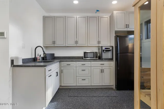 a view of a livingroom with furniture and a window