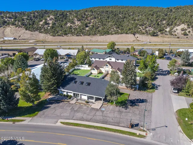 an aerial view of residential houses with outdoor space