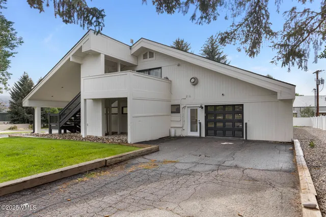 a view of a chairs and table in patio