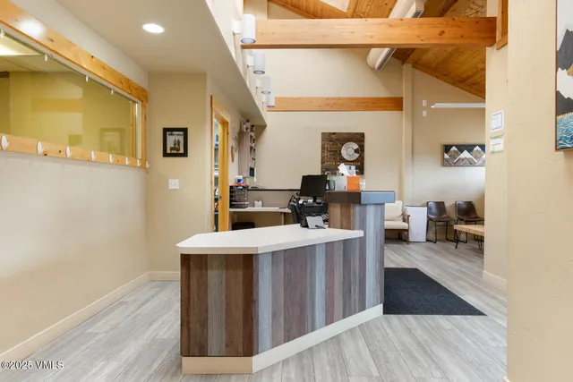 a view of a house with wooden floor and furniture