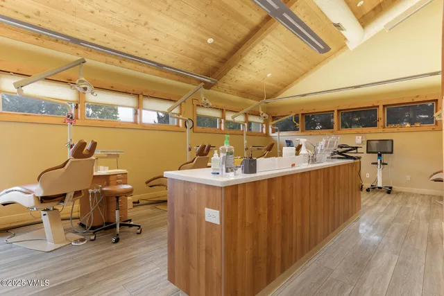 a kitchen with stainless steel appliances granite countertop a sink and wooden cabinets