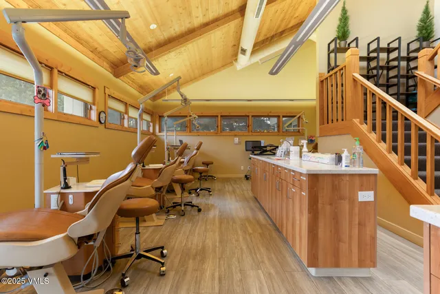 a living room with furniture a flat screen tv and a window