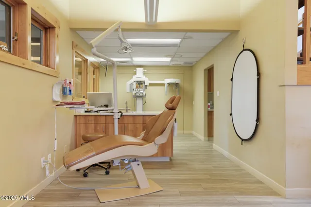 a kitchen with kitchen island a sink stainless steel appliances and cabinets