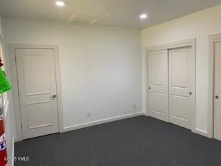 an aerial view of residential houses with outdoor space and river view