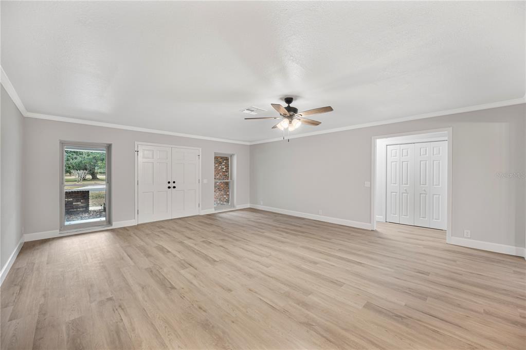 241 Greenfield Road Winter Haven, FL 33884 - Photo 11 of 43 a view of an empty room with wooden floor