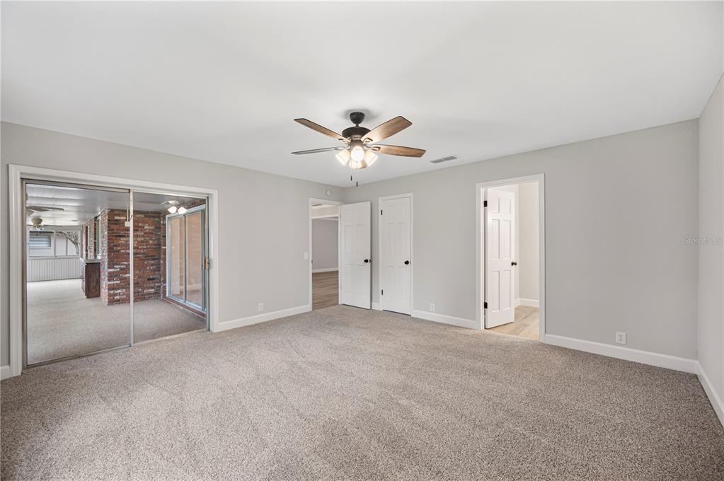 241 Greenfield Road Winter Haven, FL 33884 - Photo 18 of 43 a view of an empty room with a ceiling fan