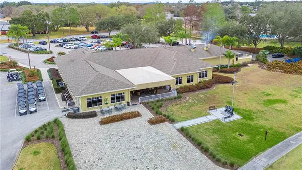 an aerial view of a house with outdoor space
