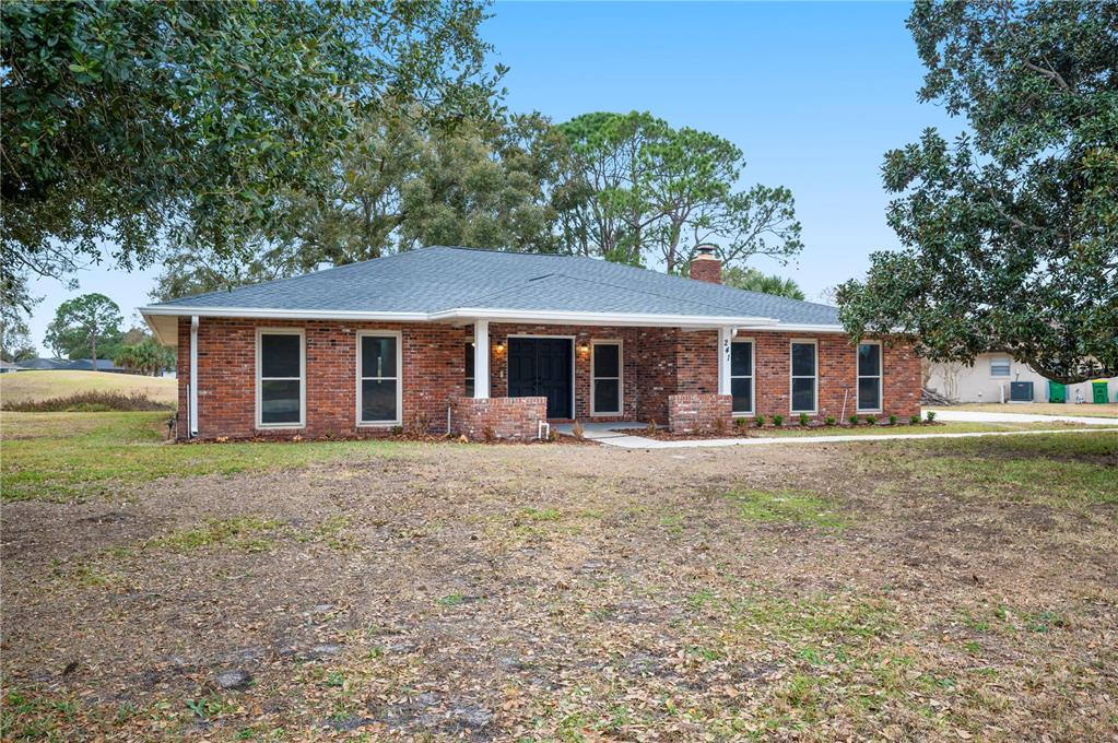 241 Greenfield Road Winter Haven, FL 33884 - Photo 41 of 43 front view of a house with a yard