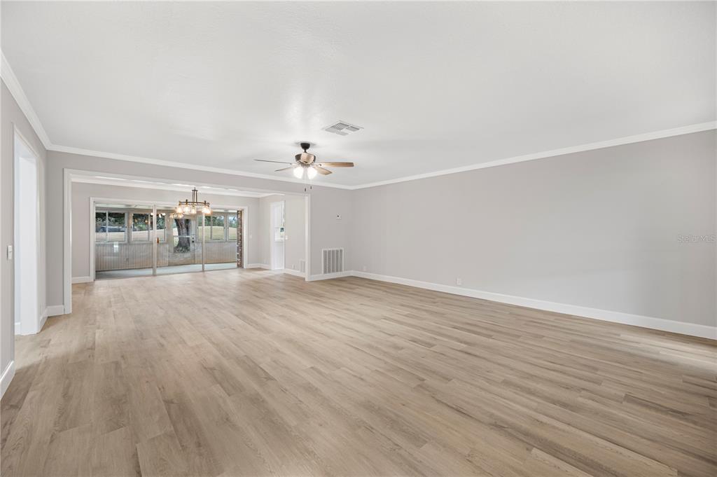 241 Greenfield Road Winter Haven, FL 33884 - Photo 10 of 43 a view of a livingroom with wooden floor