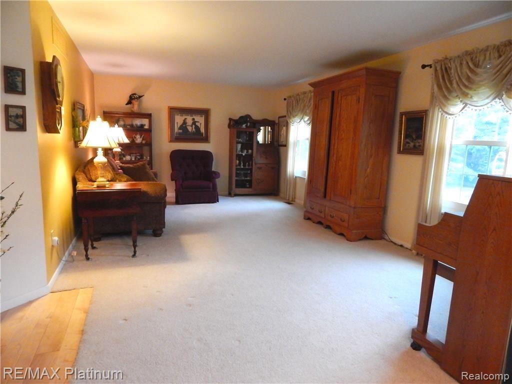 86 South Burkhart Road Howell, MI 48843 - Photo 6 of 52 Large Formal Living Room will Accommodate Large Furniture & Any Large Gathering