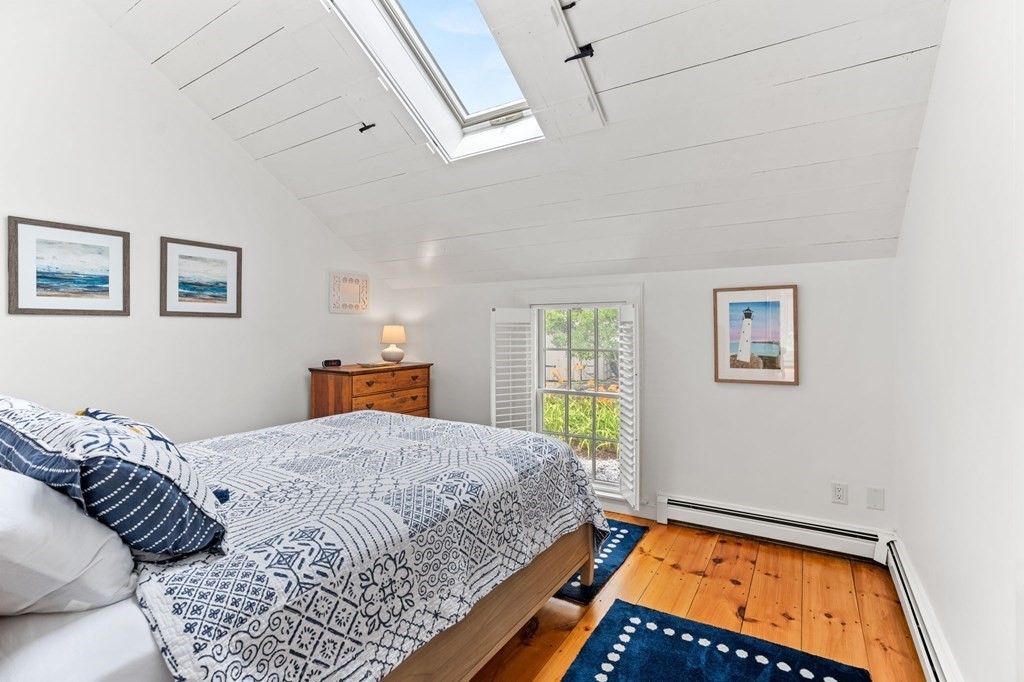 3 Folgers Way, Unit 3 Mashpee, MA 02649 - Photo 18 of 21 a bedroom with a bed and window