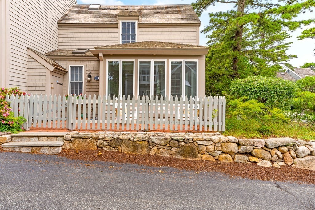 3 Folgers Way, Unit 3 Mashpee, MA 02649 - Photo 2 of 21 front view of a house with a small yard