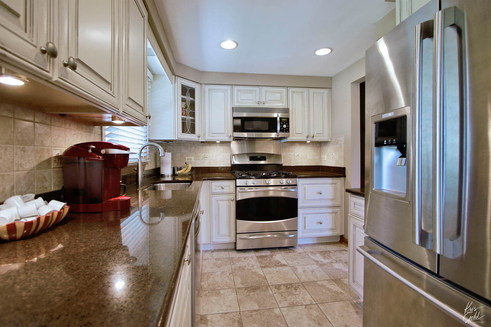 720 Stuart Street Grayslake, IL 60030 - Photo 5 of 19 a kitchen with stainless steel appliances granite countertop a refrigerator a stove a sink and a microwave