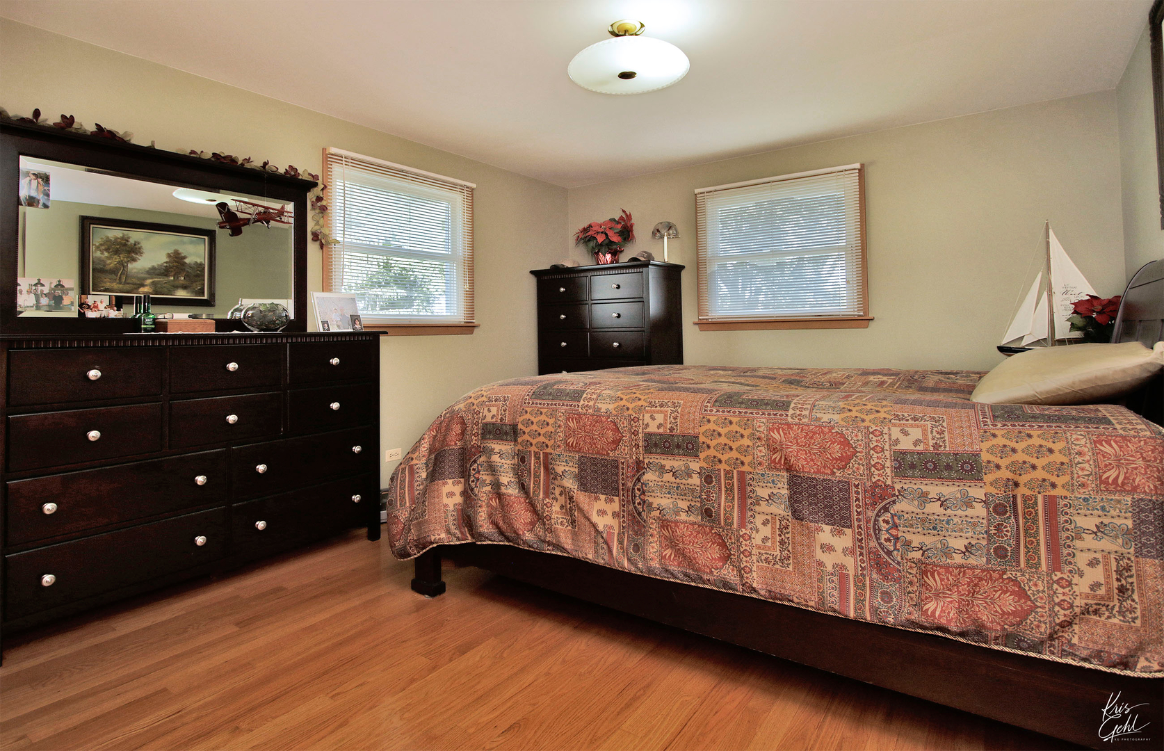 720 Stuart Street Grayslake, IL 60030 - Photo 7 of 19 a bedroom with a bed and a window