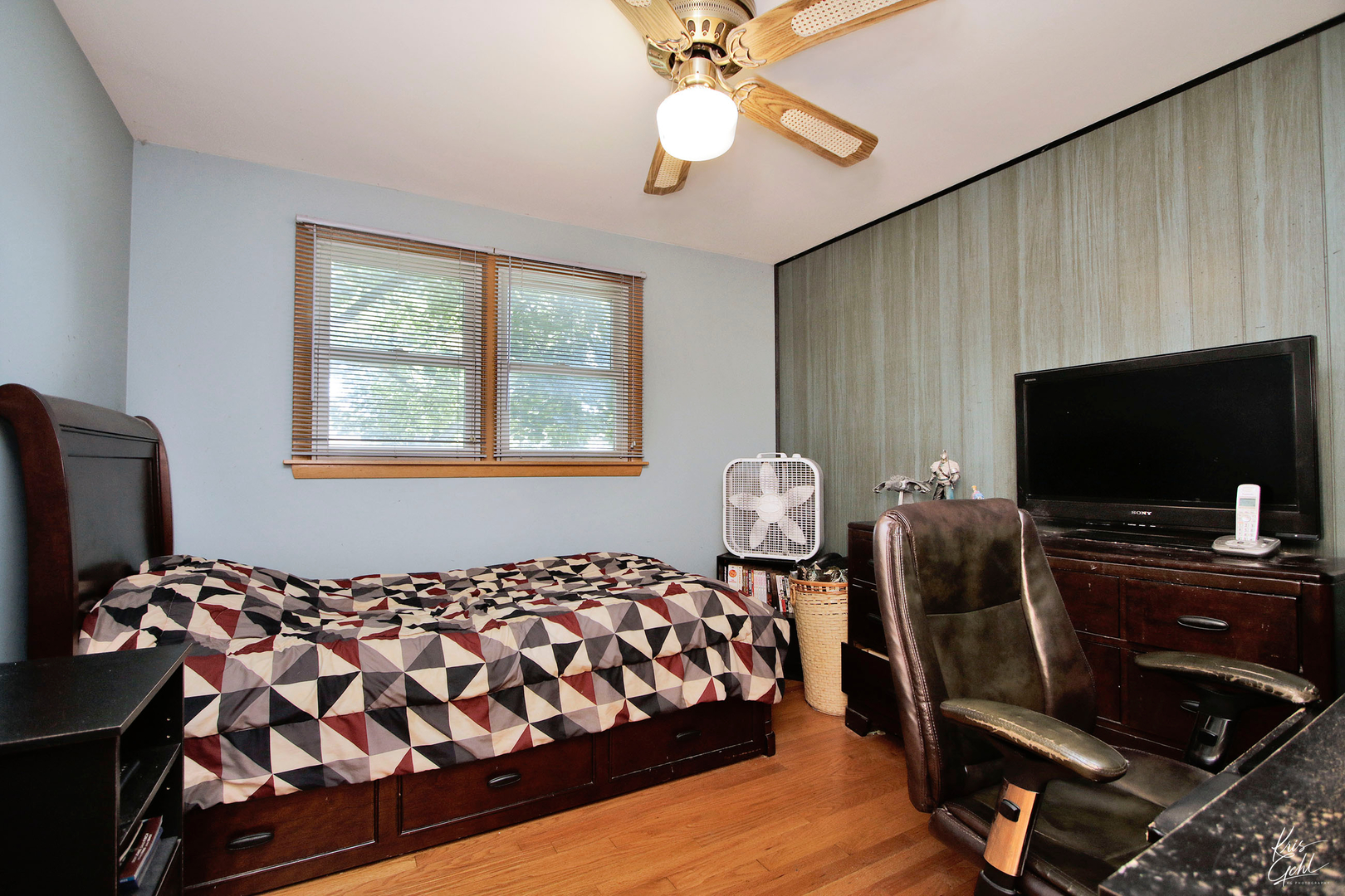 720 Stuart Street Grayslake, IL 60030 - Photo 9 of 19 a bedroom with bed and flat screen tv