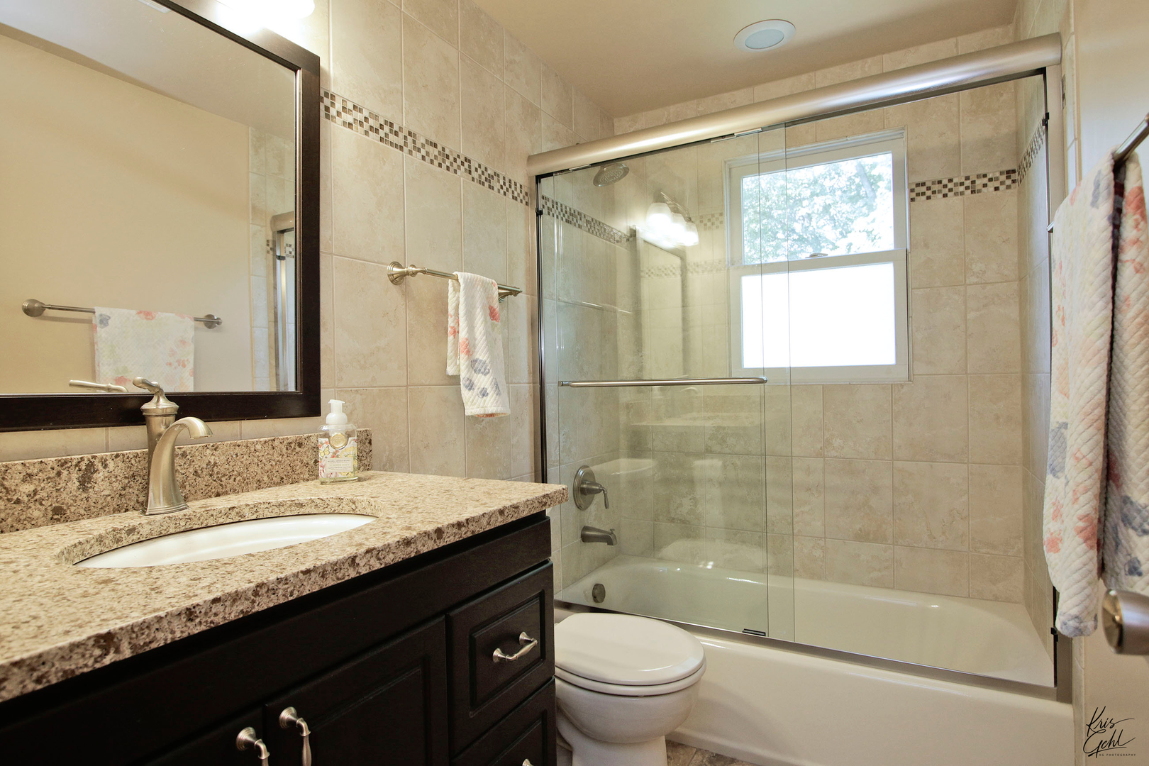 720 Stuart Street Grayslake, IL 60030 - Photo 10 of 19 a bathroom with a granite countertop sink toilet mirror and shower