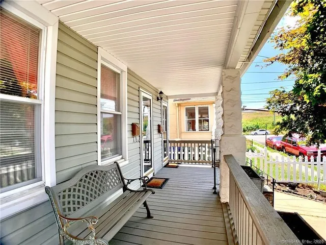 a kitchen with granite countertop a refrigerator stove and sink