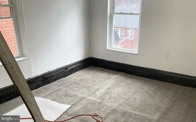 a view of an empty room and window