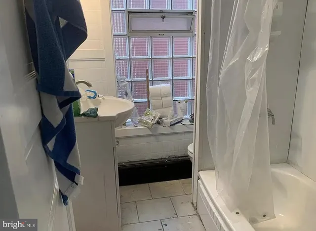 a bathroom with a sink and mirror