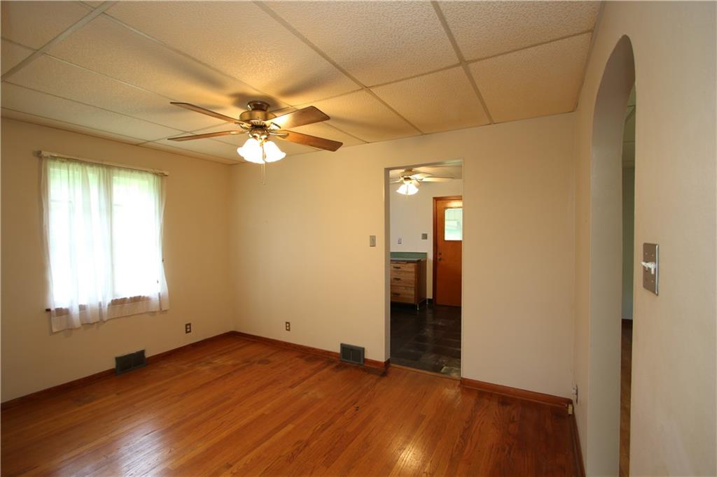 269 Rte 481 Fredericktown, PA 15333 - Photo 4 of 30 Separate 13x9 Formal Dining Room featuring Original Hardwood Floors, Ceiling Fan Light, Archway to Living Room & just off Spacious Eat-In Kitchen!