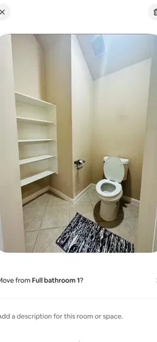 a bathroom with a sink toilet and a mirror