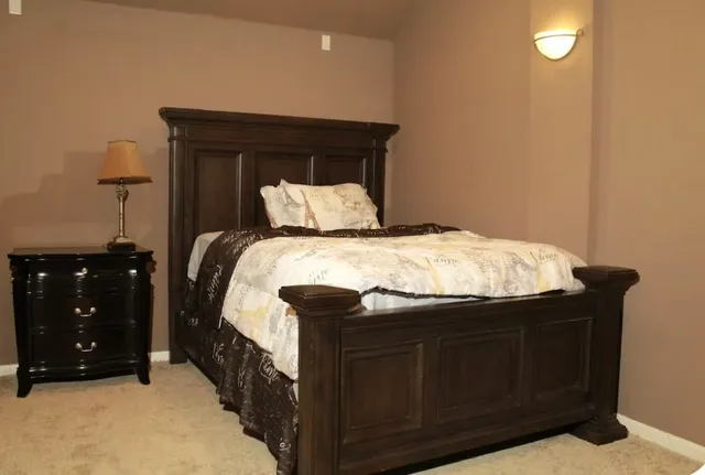 a bedroom with a bed and a closet