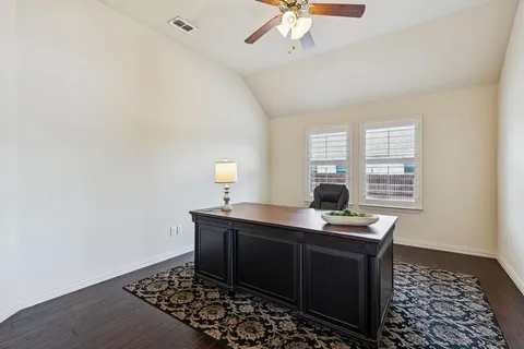 a workspace with furniture and window
