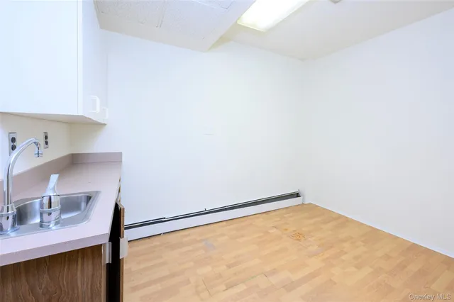 a kitchen with stainless steel appliances granite countertop a sink and cabinets