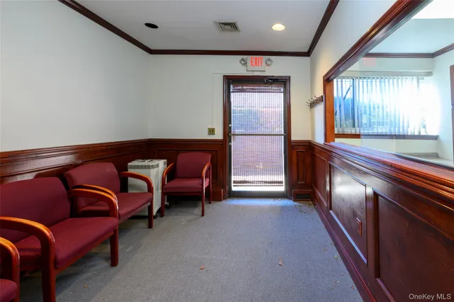 a en suite bathroom with a granite countertop sink and a mirror