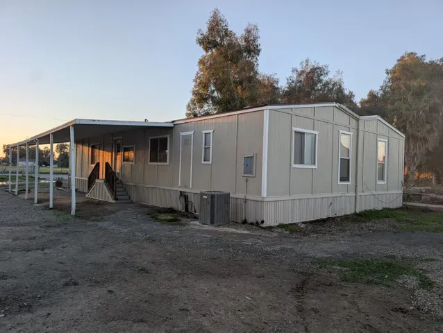 a view of a back yard of the house