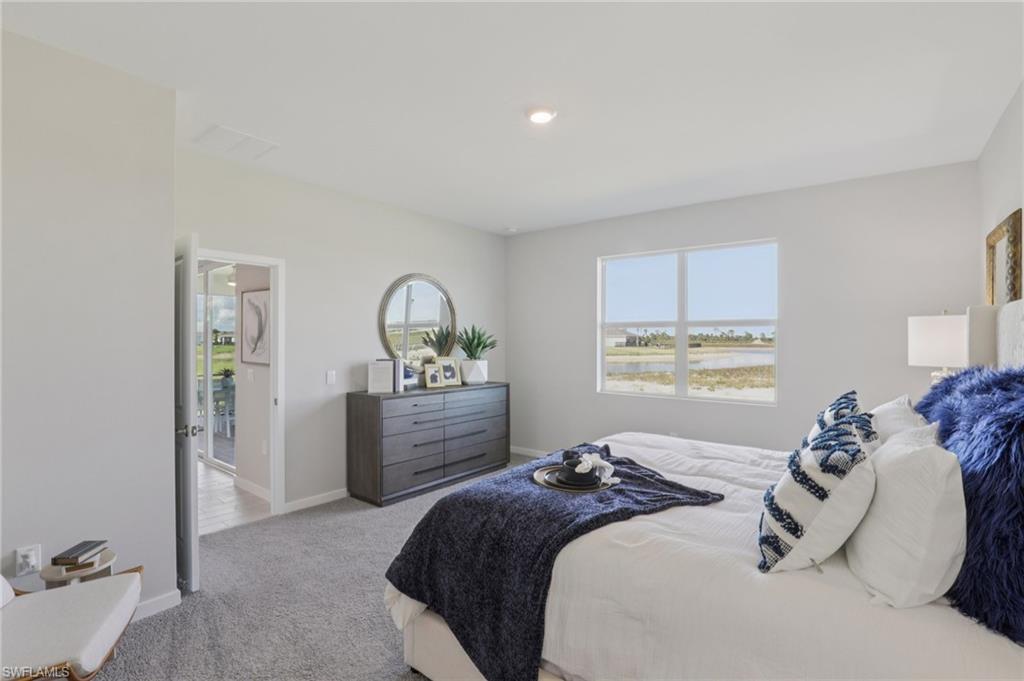 17899 Shade Tree Loop Punta Gorda, FL 33982 - Photo 12 of 47 a bedroom with a bed and a window
