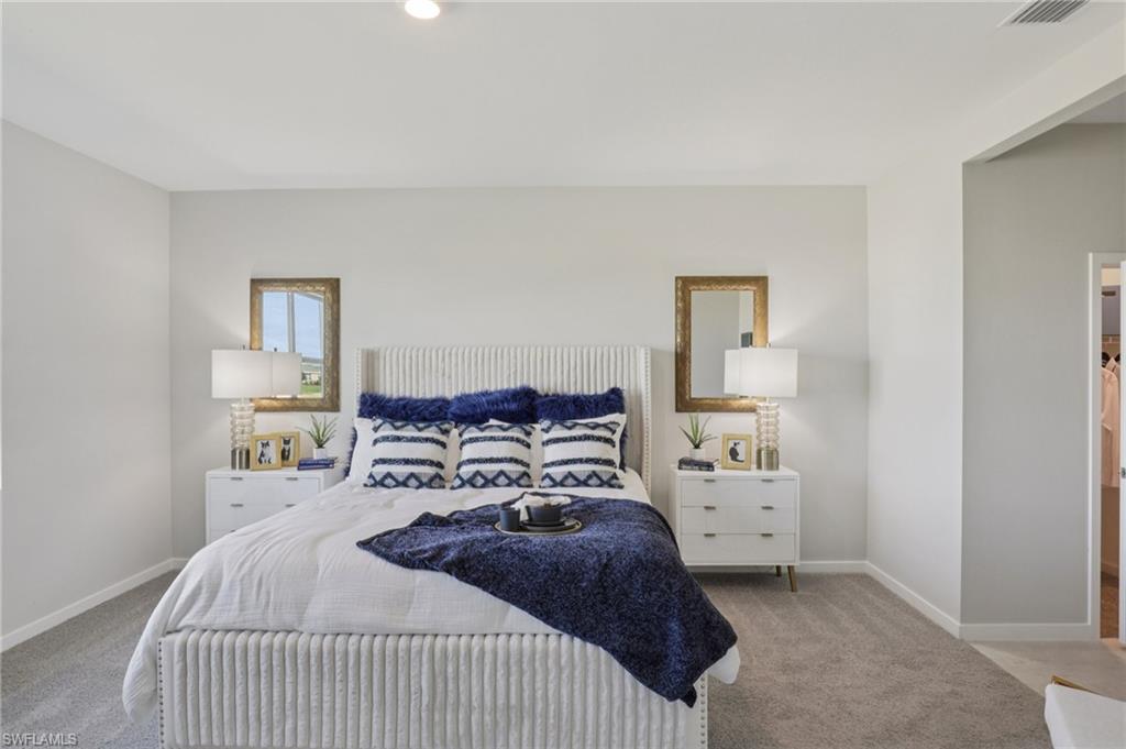 17899 Shade Tree Loop Punta Gorda, FL 33982 - Photo 13 of 47 a bedroom with a bed and a window