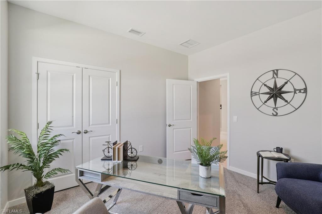 17899 Shade Tree Loop Punta Gorda, FL 33982 - Photo 15 of 47 a view of a livingroom with furniture and a potted plant