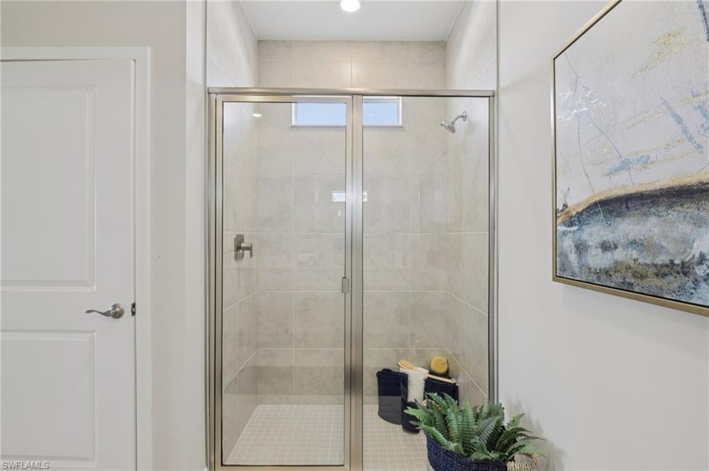 17899 Shade Tree Loop Punta Gorda, FL 33982 - Photo 18 of 47 a bathroom with a shower