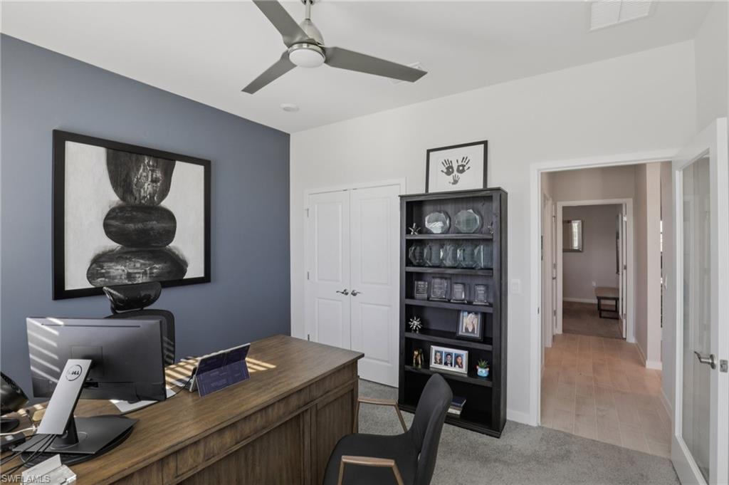 17899 Shade Tree Loop Punta Gorda, FL 33982 - Photo 20 of 47 a room with a workspace and a window