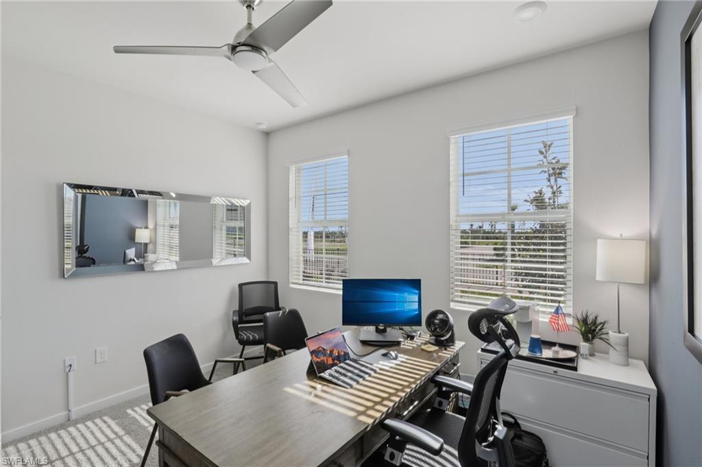 17899 Shade Tree Loop Punta Gorda, FL 33982 - Photo 21 of 47 a view of a livingroom with workspace and a window