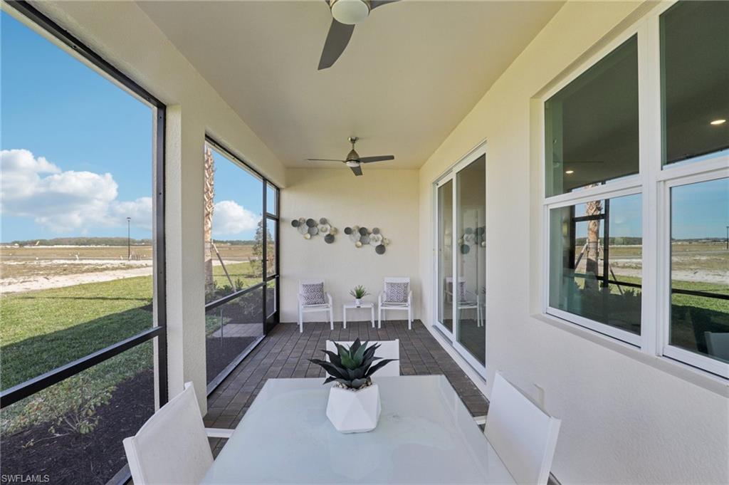 17899 Shade Tree Loop Punta Gorda, FL 33982 - Photo 22 of 47 a view of a living room with a floor to ceiling window and floor to ceiling window
