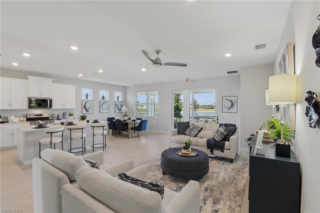 17899 Shade Tree Loop Punta Gorda, FL 33982 - Photo 3 of 47 a living room with furniture and a large window