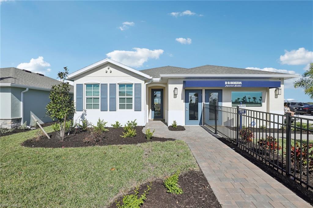 17899 Shade Tree Loop Punta Gorda, FL 33982 - Photo 47 of 47 a front view of a house with garden